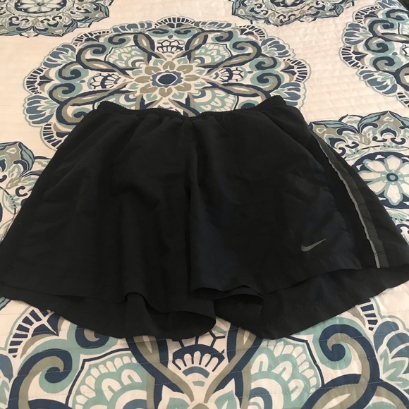 Nike dri fit men’s 5in running short. Medium/black